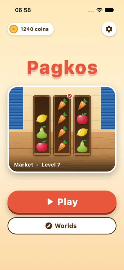 Pagkos home screen with a crate of fruit, a Play button and a Worlds button